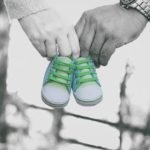 Surrogacy in Albania for Single : Parents carrying baby shoes, Emotional